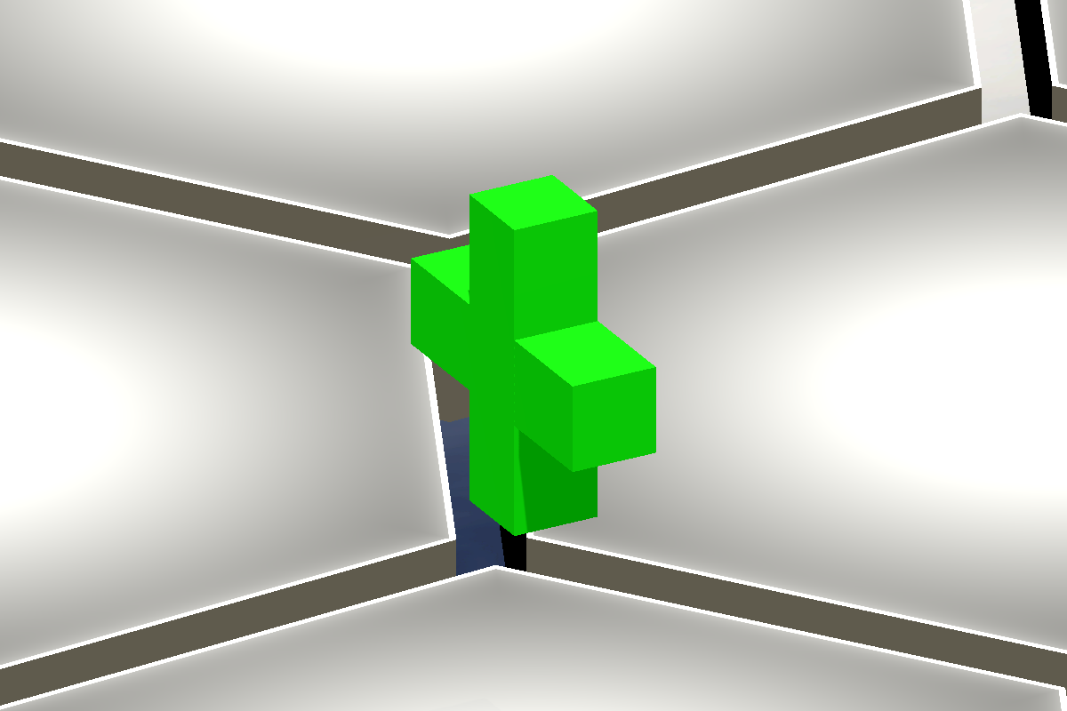 The actual bright green cross-shaped Heal pickup floating above the game floor.